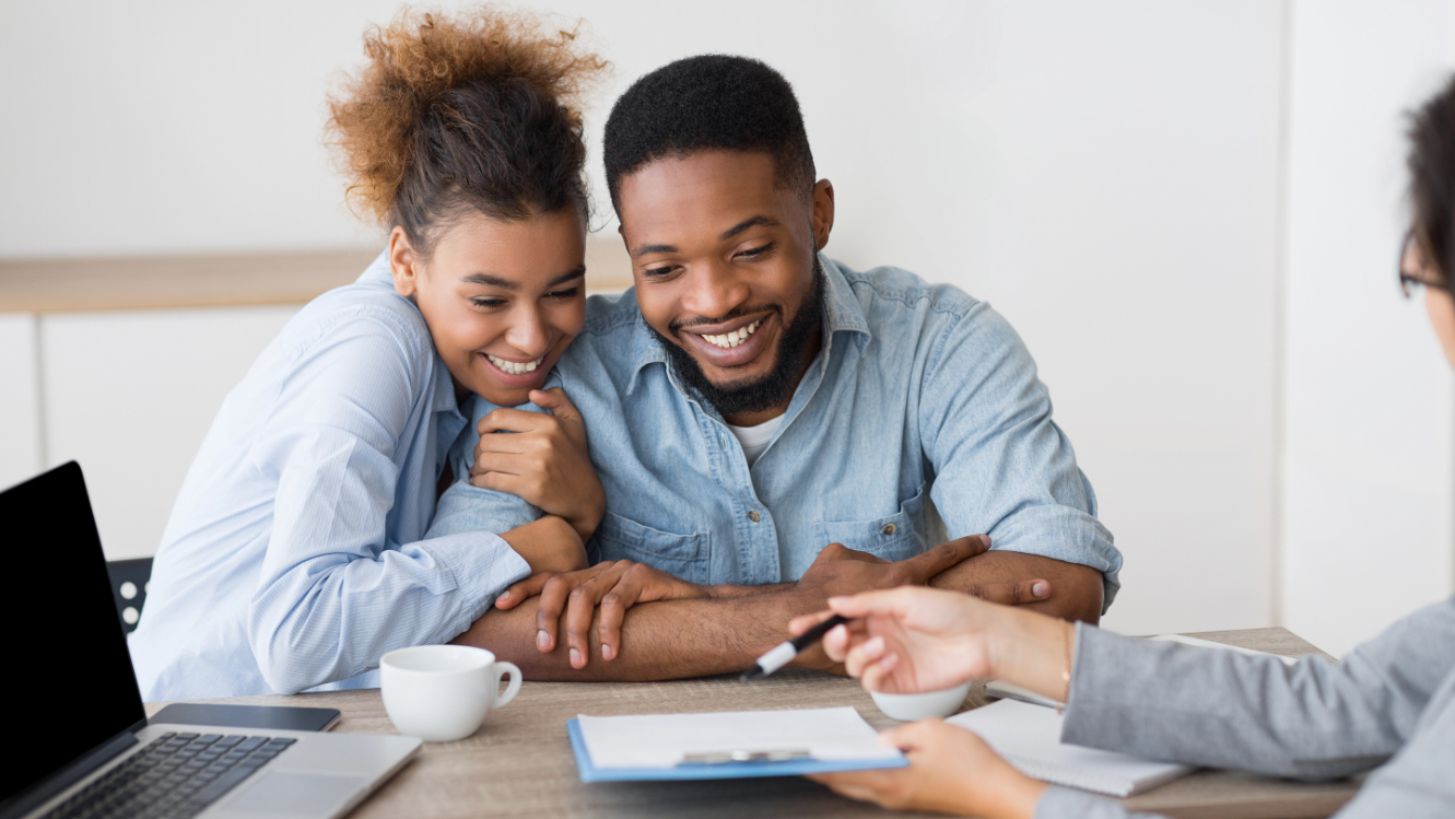 Excited Afro Spouses Planning Vacation